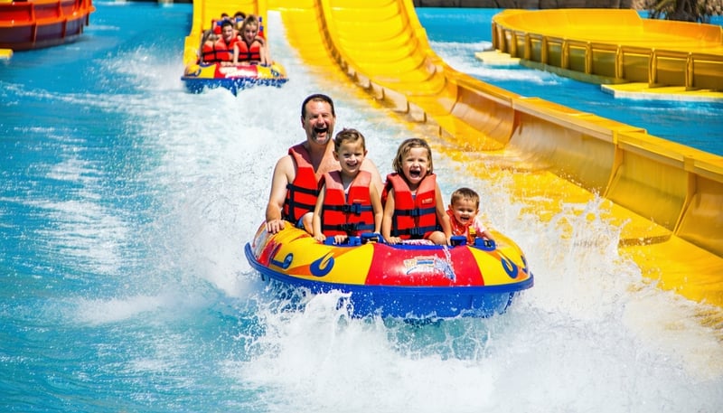 Family enjoying water rides at AquaQuest Adventure Park Dubai Family enjoying water rides at AquaQuest Adventure Park Dubai